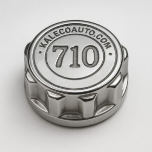 A chrome oil cap labeled "710"