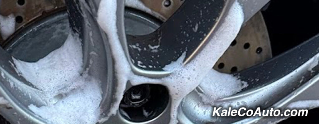 a soapy wheel being cleaned